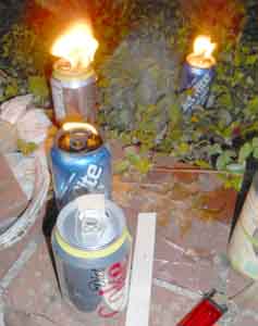 Soda can Tiki torch by Tom Lohre.