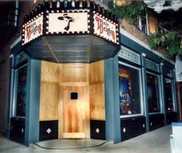 Image of the facade of Trixie's Delight a strip club in Newport, Kentucky, murals painted mby Tom Lohre.